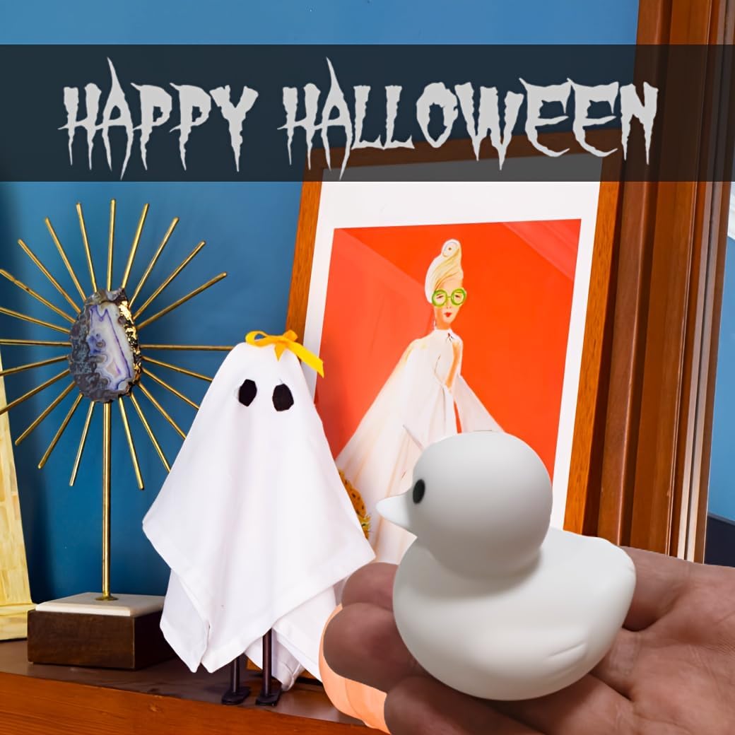 Ghost rubber ducks displayed on Jeep dashboard for ducking trend – spooky Halloween version