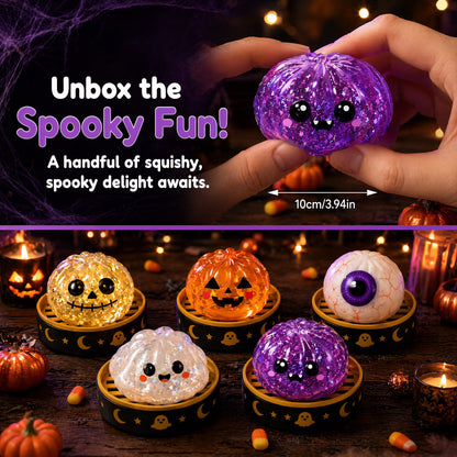 Five Okie Soft Play Halloween Bun Squishy Toys – Filled TPR Fidget Characters shaped like pumpkins, ghosts, and eyeballs are displayed on black trays with gold stars. One purple Halloween Bun Squishy Toy is held above by a hand. Spooky Halloween decorations surround the toys.