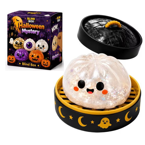 A cute, glittery Halloween Bun Squishy Toy from Okie Soft Play, with a smiling face, sits in a steamer basket next to a Halloween-themed blind box featuring more Filled TPR Fidget Characters and festive dumpling decorations.