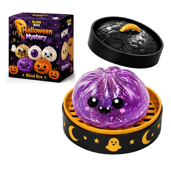 An adorable purple, glittery Halloween Bun Squishy Toy – Filled TPR Fidget Character from Okie Soft Play, featuring a cute face, sits in a yellow tray adorned with moon and ghost designs. Nearby are its packaging and a black lid with a yellow worm. The box displays “Halloween Mystery Blind Box.”.