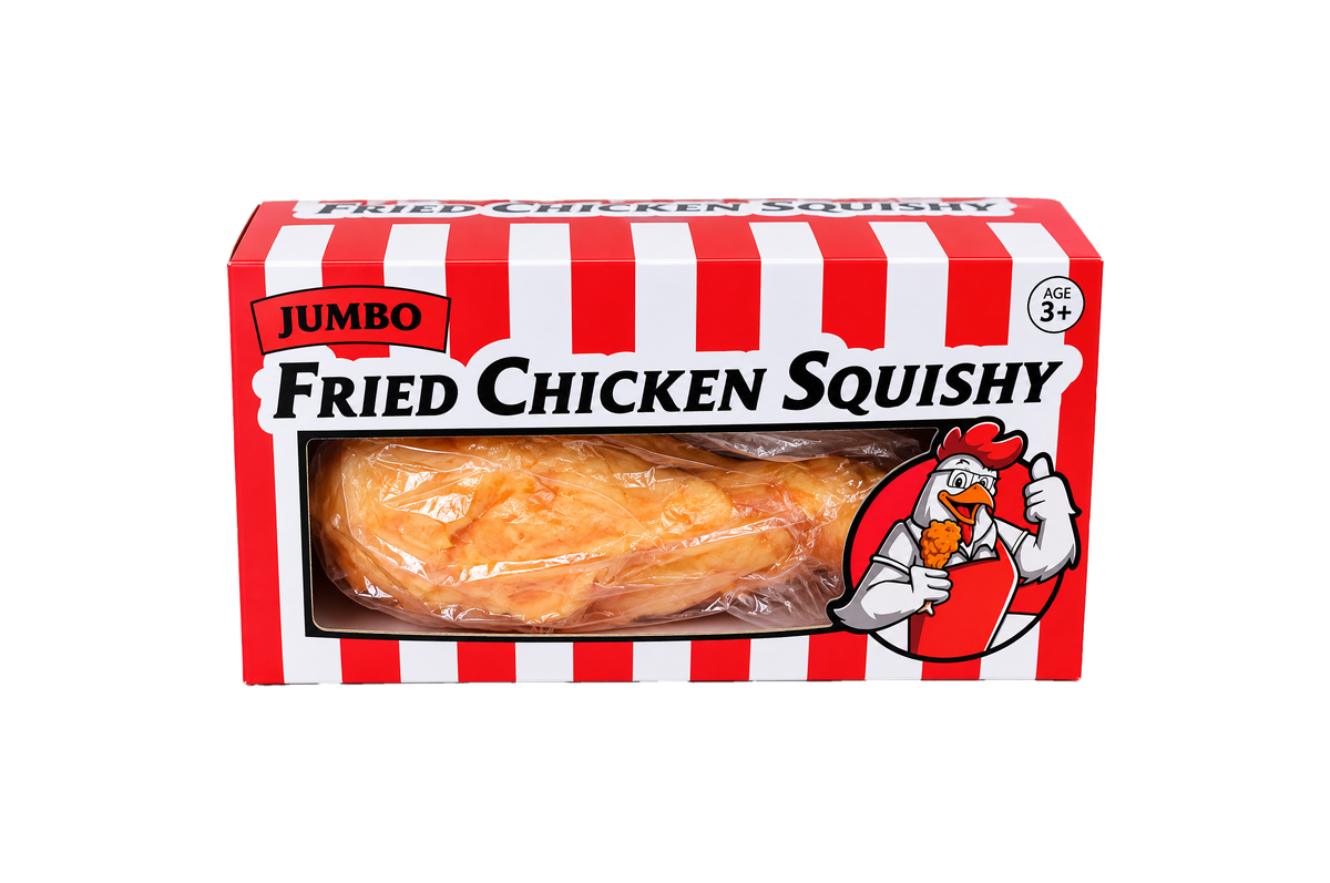 The Okie Soft Play Giant Chicken Leg Squishy – Extra-Large TPR Flour-Filled Stress Toy comes wrapped in plastic and is displayed in a red and white striped box, featuring a cartoon chicken holding an orange drumstick on the packaging. Suitable for ages 3 and up.