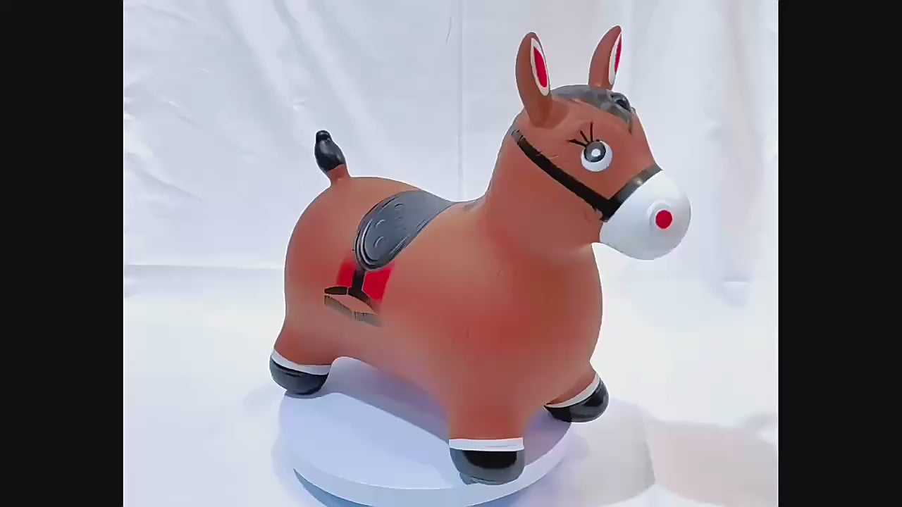Inflatable brown horse hopper toy by Okie Soft Play, shown rotating on white platform with black hooves and red saddle
