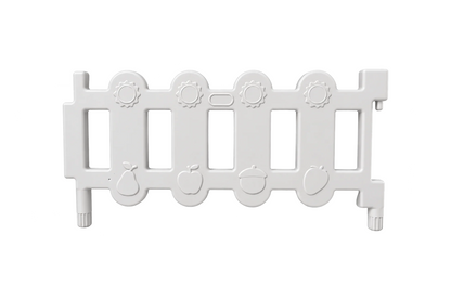 A white plastic Okie Soft Play Toddler Fence Panel, CPC Certified for safety, featuring vertical rectangular openings and embossed fruit and acorn designs along the bottom edge, shown on a plain white background.